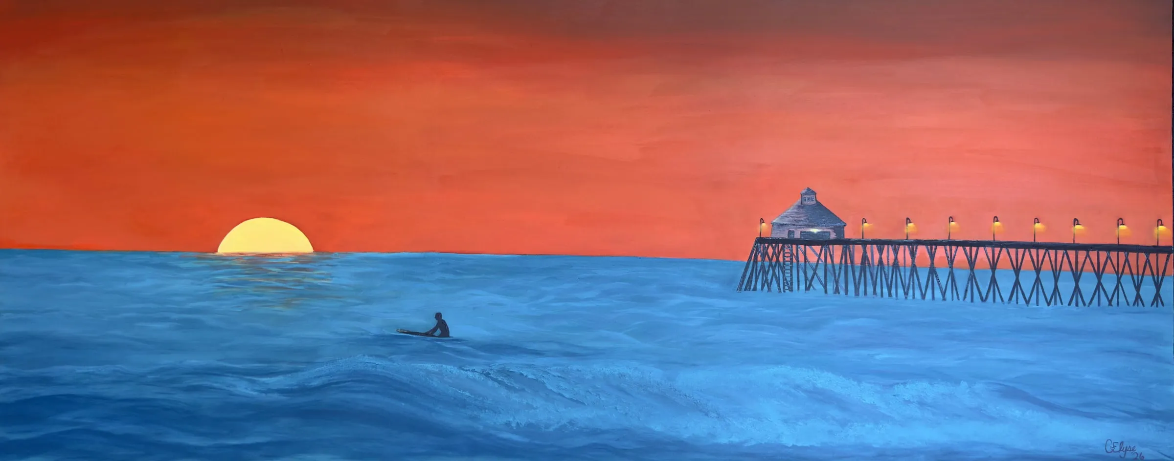 A blazing orange sunset over a deep blue ocean: the sun half-set on the horizon, a lone surfer waiting on a board, and a long pier with glowing lamps and a small building at its end.